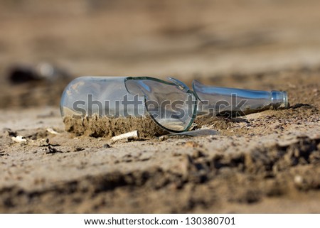 broken glass bottle in the sand