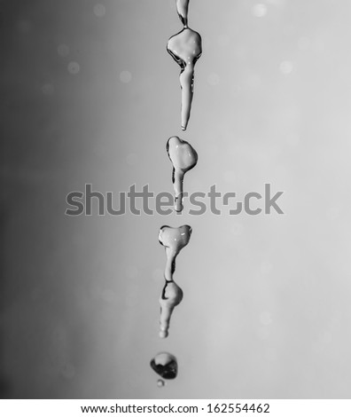 a jet of water on a gray background