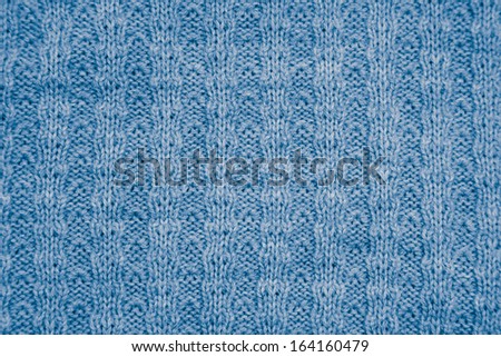 blue knitted fabric as a background. macro