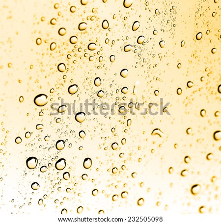 water drops on glass with gold