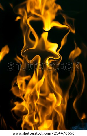 face on fire on a black background