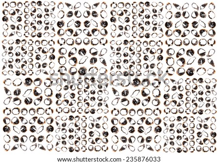 Collection of burnt holes in a piece of paper isolated on white background