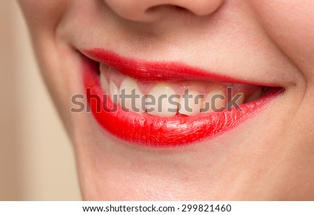 Smiling female red lips and healthy white teeth closeup shot with