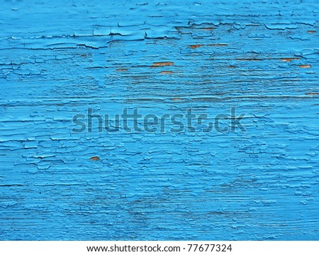 Closing on blue wooden panels of the fence