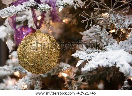 Beautiful Christmas tree ornament hanging on a pine tree as part of the holiday season