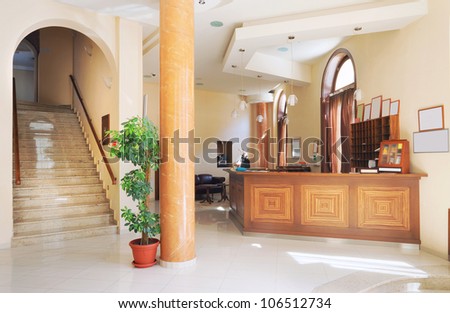 Interior of a hotel, view on reception. Modern wooden design.