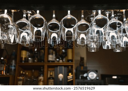 Similar – Image, Stock Photo Clean glasses hanging in bar