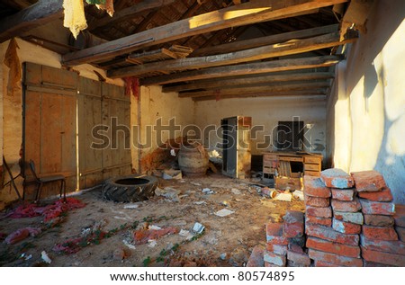 Interior of an old ruined house, old textures and furniture.