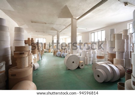 Interior of a warehouse in a printing factory, raw materials in stock.