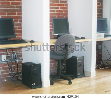 a row of computer terminals