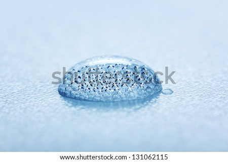 Carbon dioxide gas bubbles inside of mineral water drop