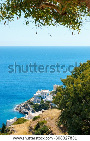 White hotels on the blue sea side on Ios island, Greece