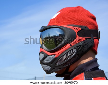Paintball player\'s head covered with mask