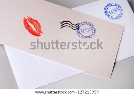 composition on the theme of Valentine\'s Day - blank envelope and a card with the imprint of a kiss