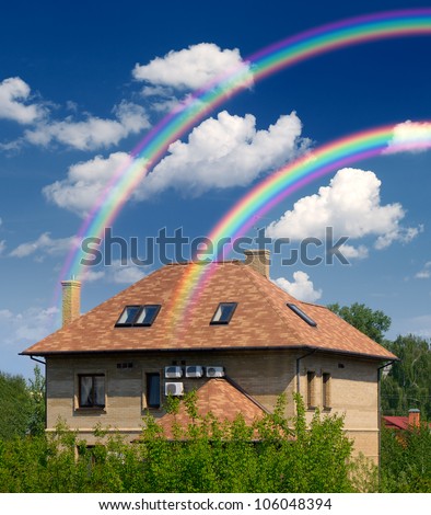 Nice house and nice weather with a rainbow