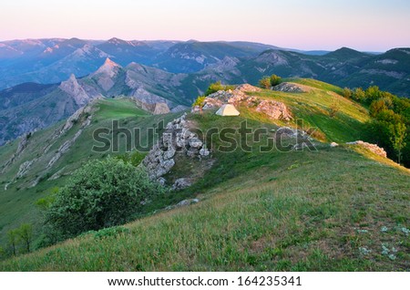 Mountain landscape with a tent. Morning with the first rays of the sun. The peninsula of Crimea; Ukraine; Europe