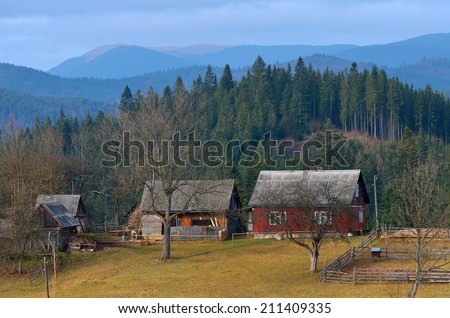 Autumn landscape with old wooden houses in the mountain village. Carpathians, Ukraine, Europe