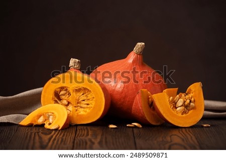 Image, Stock Photo Hokkaido pumpkin in red in a round basket on old cobblestones in the Hanseatic town of Lemgo near Detmold in East Westphalia-Lippe