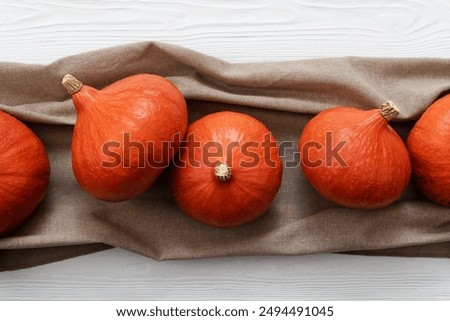 Similar – Image, Stock Photo Hokkaido pumpkin in red in a round basket on old cobblestones in the Hanseatic town of Lemgo near Detmold in East Westphalia-Lippe