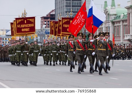 NOVOSIBIRSK - MAY 9: The on parade dedicated to Victory Day in World War II, soldiers endure the national flag of Russia on May 9, 2011, Novosibirsk Russia