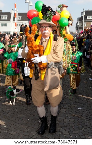 MAASTRICHT, THE NETHERLANDS - MARCH 6: Unidentified man in the Carnival parade dressed as bush explorer on March 6, 2011 in Maastricht, The Netherlands. This parade is organized every year with about 100,000 visitors