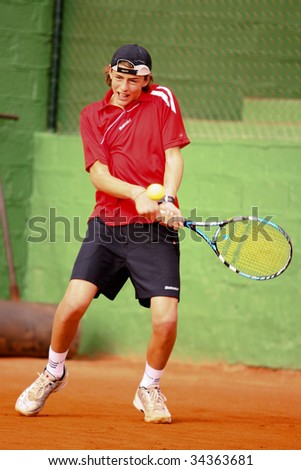 MALAGA, SPAIN – JANUARY 11 : Albert Alcaraz in action during the final match of the 1st round of the Nike Junior Tennis Tour tournament at Malaga Tennis Club January 11, 2009 in Malaga, Spain.
