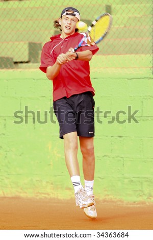 MALAGA, SPAIN – JANUARY 11 : Albert Alcaraz in action during the final match of the 1st round of the Nike Junior Tennis Tour tournament at Malaga Tennis Club January 11, 2009 in Malaga, Spain.
