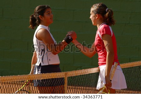 MALAGA, SPAIN – JAN 11 : Maria Jose Luque (L) and  Silvia Fuentes (R)  after the final match of the 1st round of the Nike Junior Tennis Tour tournament at Malaga Tennis Club January 11, 2009 in Malaga