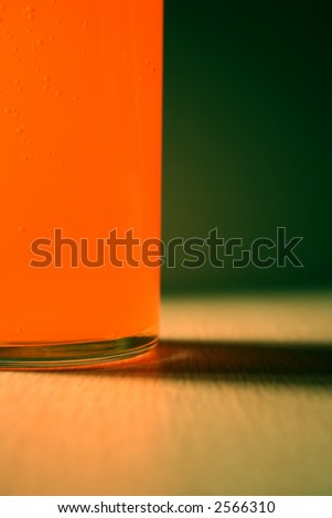 abstract glass with orange drink