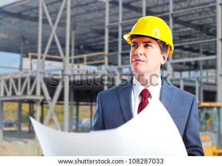 Engineer constructor with a project. Industrial worker.