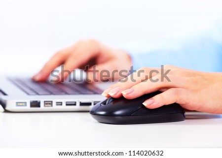 Hand with a computer mouse. Business technology background.