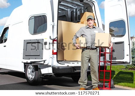 Happy professional shipping courier. Delivery postal service.
