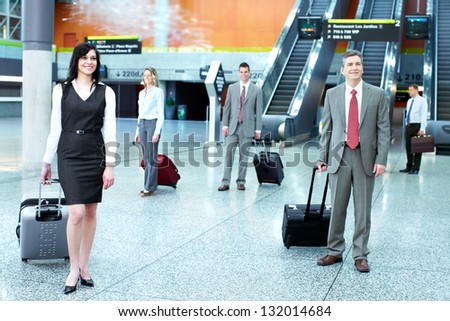 Group of business people in airport. Travel background.