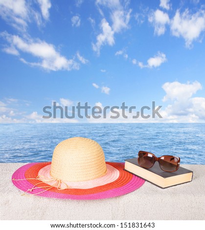 Hat and book. Summer vacation beautiful background.