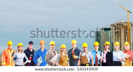 Group of builders workers. Construction industry background.
