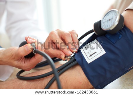 Blood pressure measuring. Doctor and patient.  Health care.