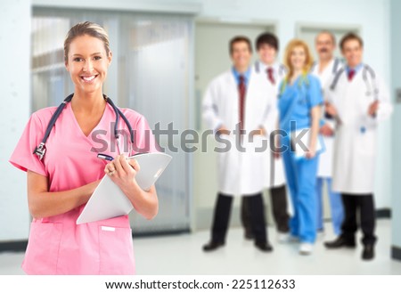 Medical doctors team over blue hospital background