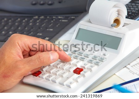 Hand of accountant man with calculator. Accounting