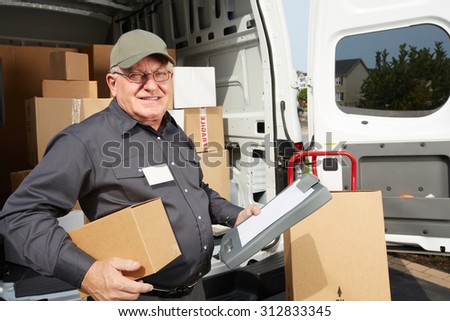 Elderly delivery man with parcel. Shipping service.