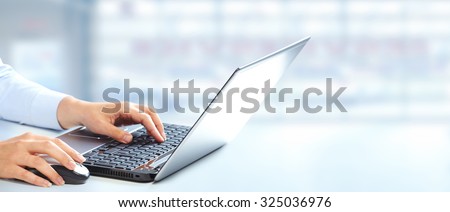 Hands of business woman typing on computer keyboard.