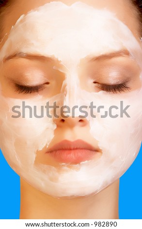 Sweet skincare. Attractive girl applying face pack.