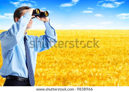 business man  with binoculars looking to the future