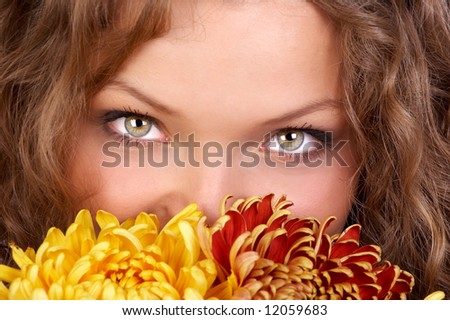 Smiling woman face with flowers. Close up
