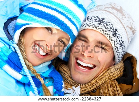 Young  happy smiling couple in love. Winter