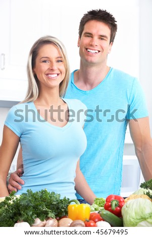 Young love couple cooking at kitchen