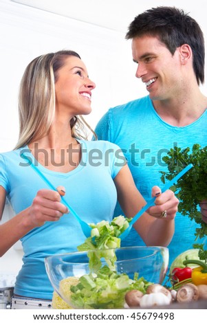 Young love couple  drinking milk and eating cereals. Over white background
