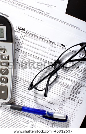 Form 1040. Standard US Income Tax Return. Calculator. Eyeglasses