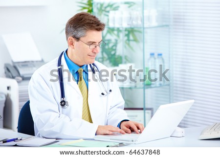 Medical doctor working with laptop in the office