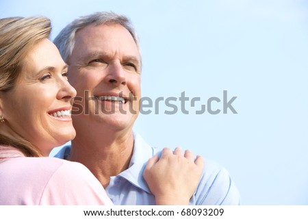 Smiling happy  elderly couple in summer park