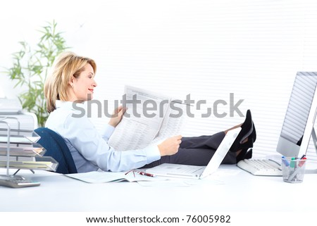 Smiling business woman  working at modern office